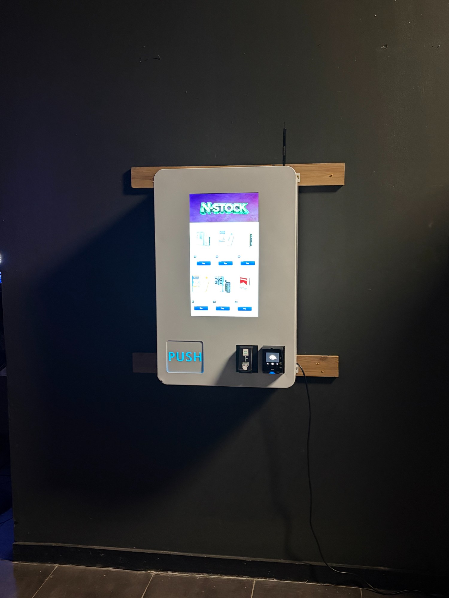 N-Stock vape machine with phone charger station at a restaurant